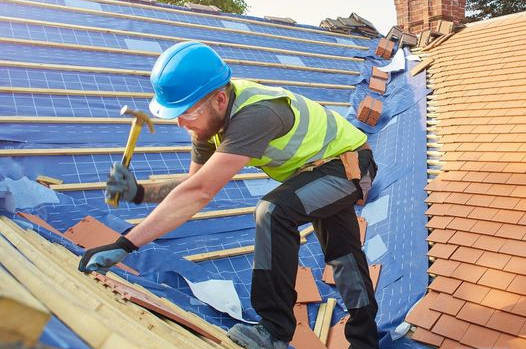 The owner of the company is hard at work on the exterior envelop of this house