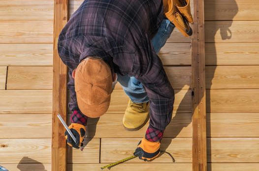 The owner of the company is demonstrating his precision and attention to detail