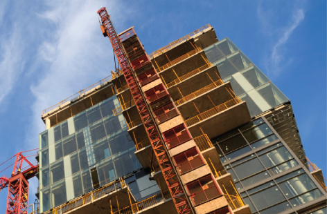 A modern residential home under construction, showcasing quality craftsmanship, framing, and exterior detailing in progress.
