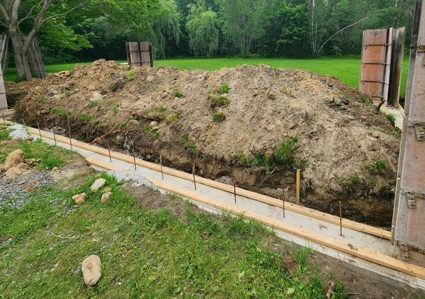 A mountain of dirt has been excavated for the foundation of this industrial complex